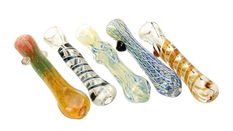  Five multi colored glass chillum pipes are lined up. 
