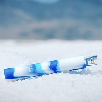 Blue and white silicone chillum on snow